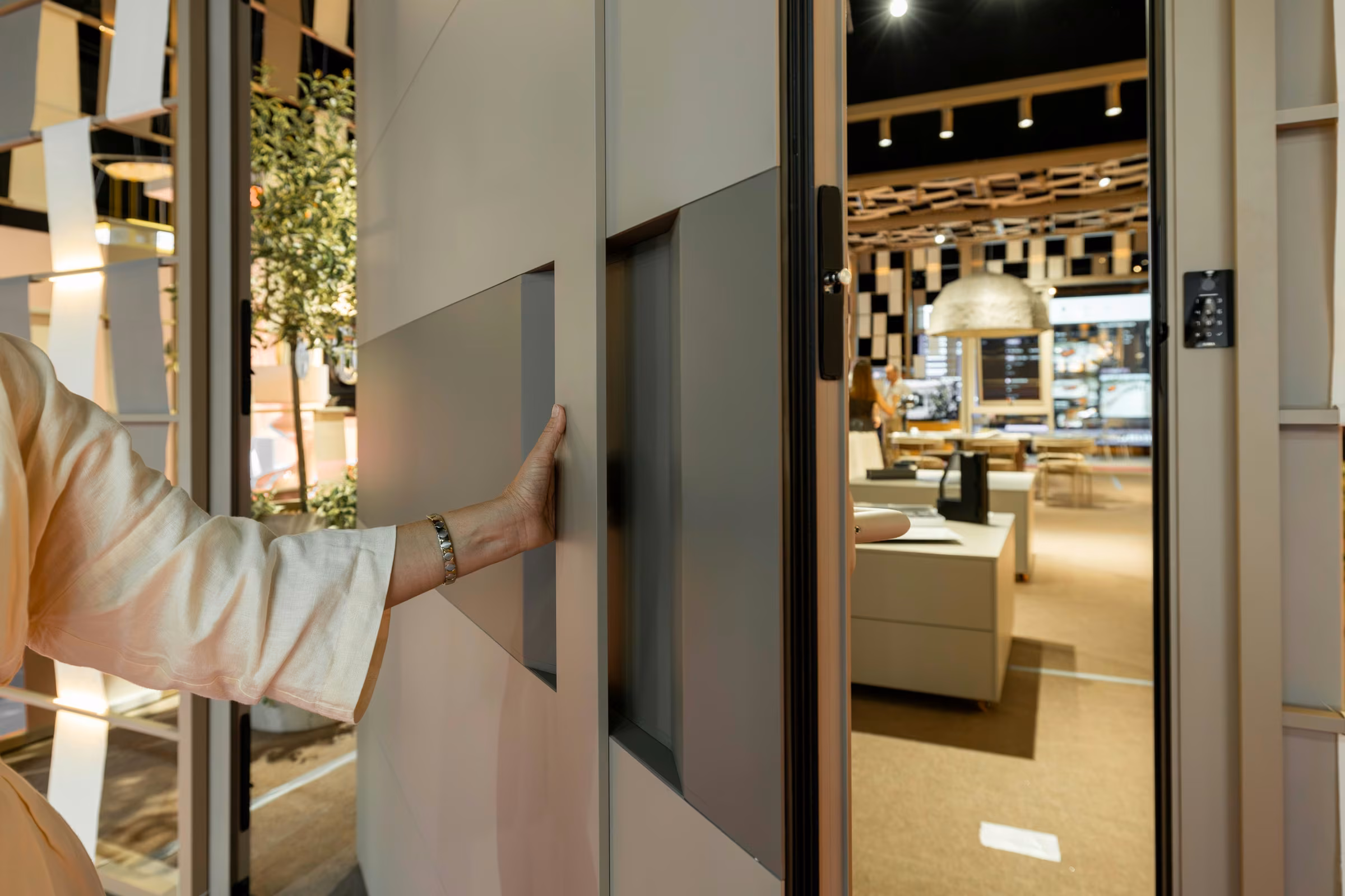Demonstration of a two-tone geometric panel door at the Plastregal exhibition stand.